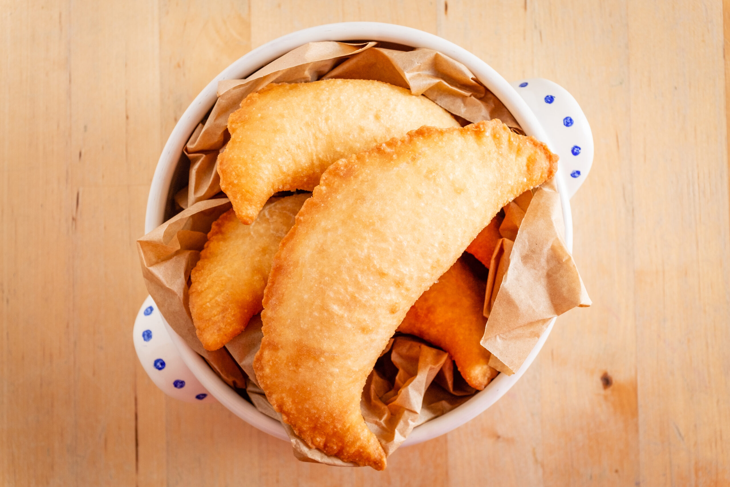 Three delicious fried panzerotto on a bowl. typical food of puglia, italy